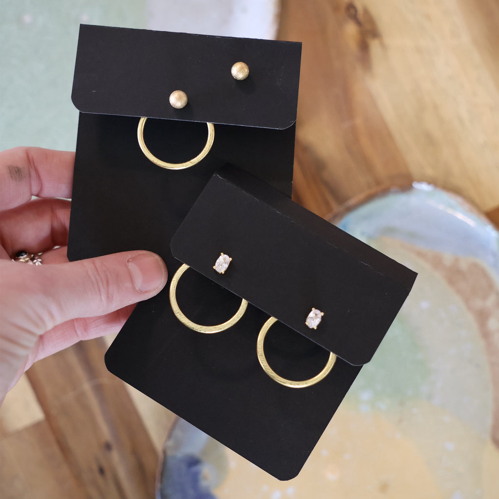 The One Inch Circle, gold, pair of earrings and just one earring