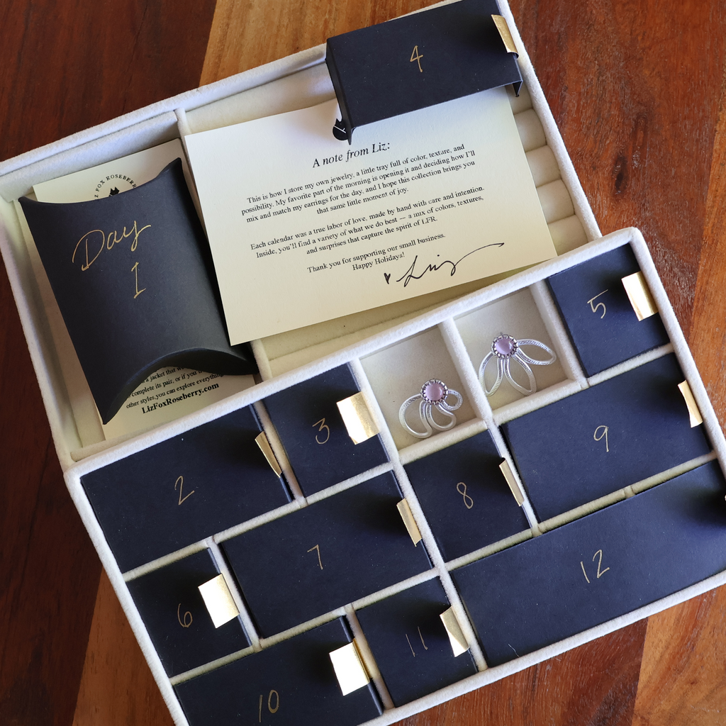 Advent calendar with numbered compartments on a wooden surface