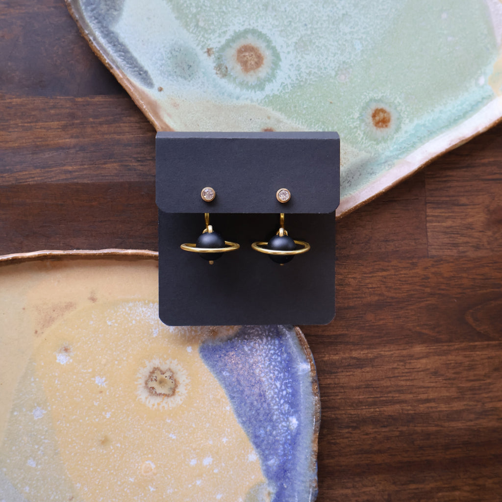 The Matte Black Onyx Saturn, gold, pair of earrings